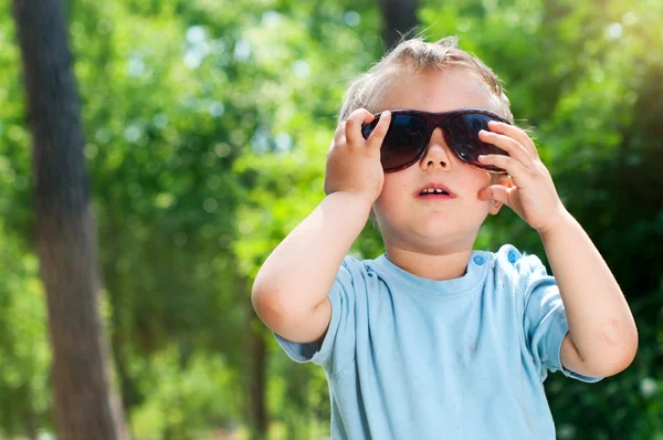 Boy in the summer park — Stock Photo, Image