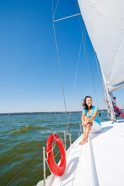 Young girl sitting on a yacht — Stock Photo, Image