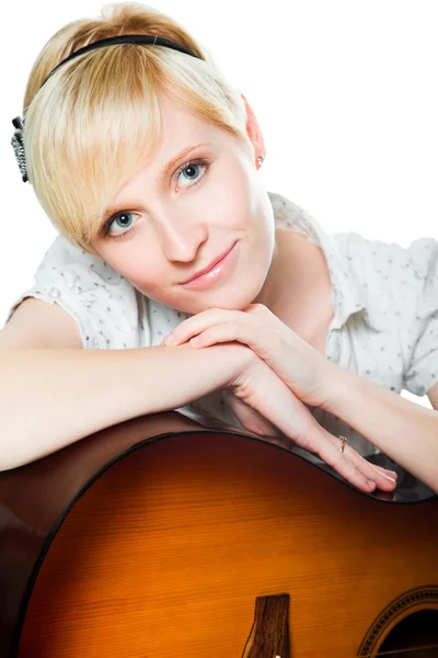 stock image Blond woman with guitar on isolated white