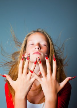 Girl with closed eyes and fashionable design of nails clipart