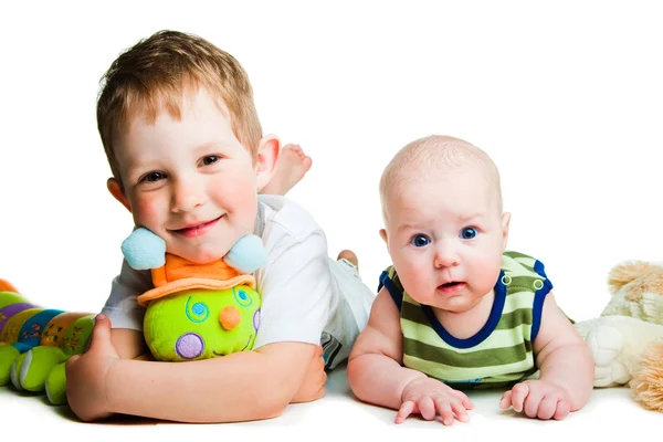 Cute brothers with toy caterpillar on isolated white — Stock Photo, Image