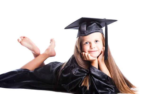 Cute little girl in graduation dress on isolated white — Stock Photo, Image