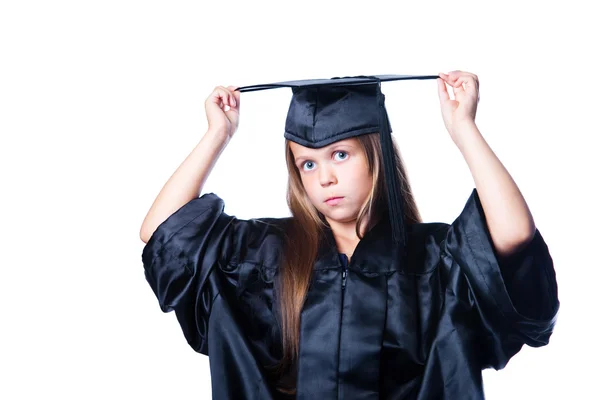 Niña seria en vestido de graduación en blanco aislado — Foto de Stock
