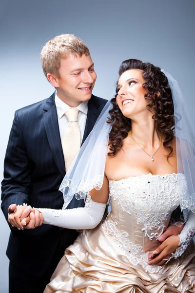 Just married groom and bride on blue — Zdjęcie stockowe