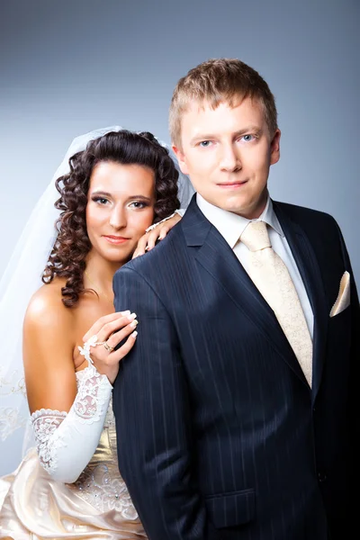 Just married groom and bride on blue — Zdjęcie stockowe