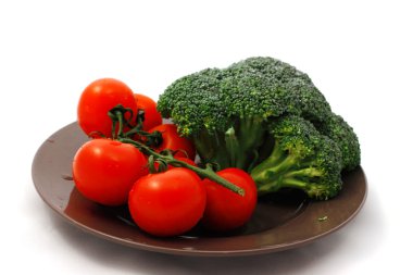 Tomatoes and cabbage on the plate clipart