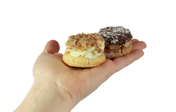 Zwei Desserts auf der Hand isoliert — Stockfoto