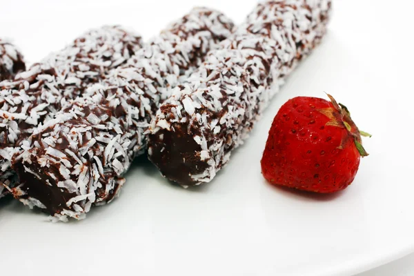 stock image Coconut rolls and strawberry