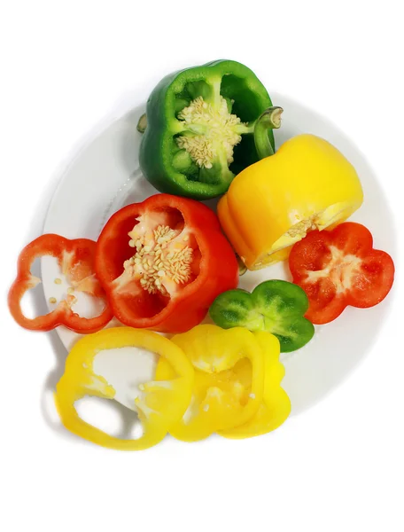 Cut sweet peppers on the plate — Stock Photo, Image
