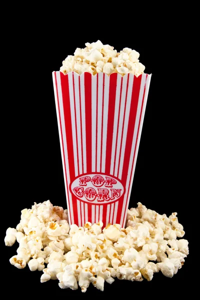 Popcorn in bag with popcorn around — Stock Photo, Image