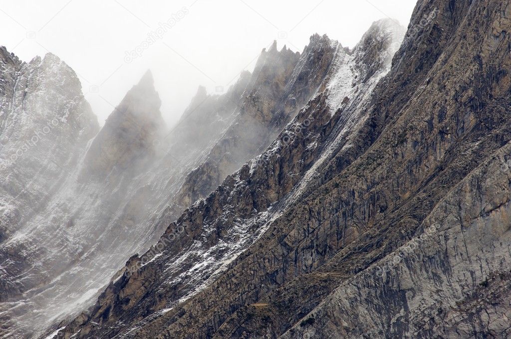 Rugged mountains in the winter fog