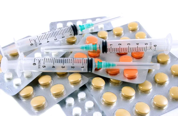 Syringes and tablets — Stock Photo, Image