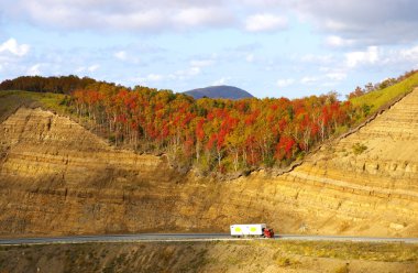 Road in autumn mountain clipart