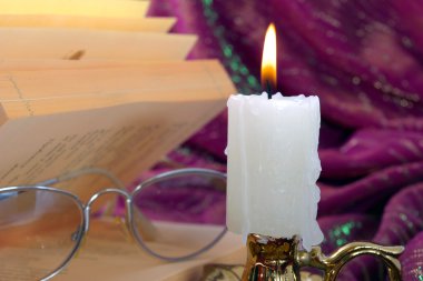 Candle and book clipart