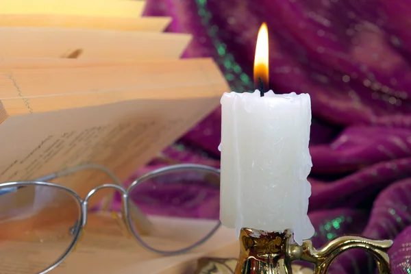 Candle and book — Stock Photo, Image