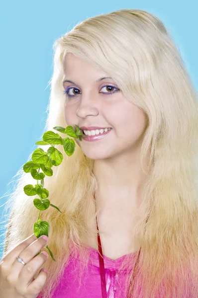Blonde girl holds a mint — Stock Photo, Image