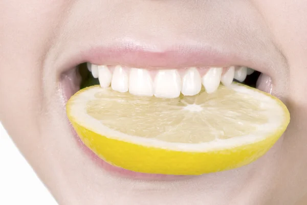 Lemon in a teeth Stock Picture