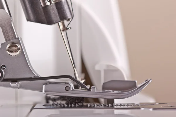 Stock image Foot sewing machine with two needles and filled thread