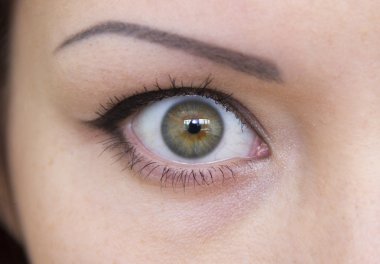 One open girl's green eye clipart