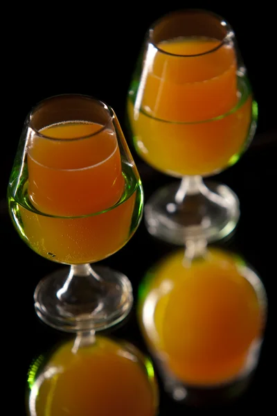 stock image Orange and carrot drink in elegante glasses