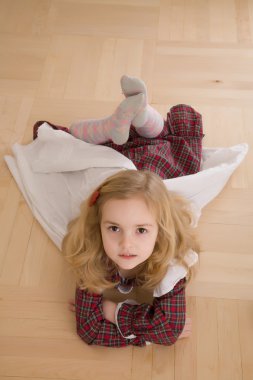 Pretty girl lying on the floor clipart