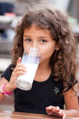 Girl and glass of milk clipart