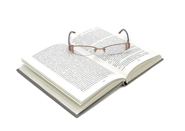 Abrir livro e óculos em um fundo branco — Fotografia de Stock