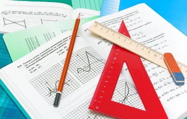 Mathematics textbook, notebook, pencil and ruler