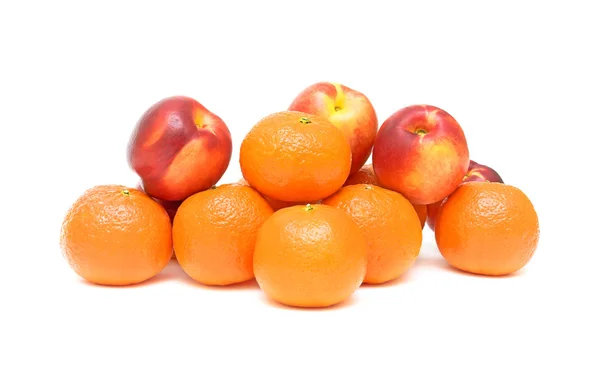 Nectarines and tangerines on a white background — Stock Photo, Image
