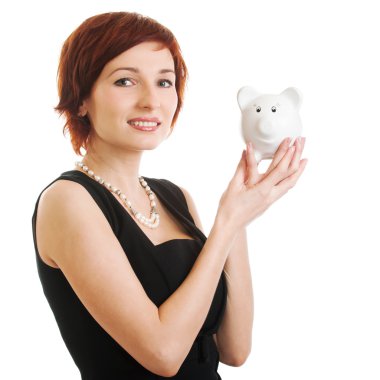 Woman holding piggy bank against white background