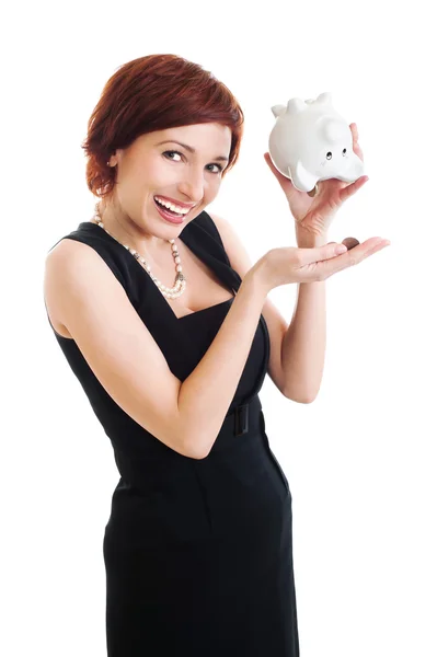 Schöne junge Frau mit Sparschwein vor weißem Hintergrund — Stockfoto