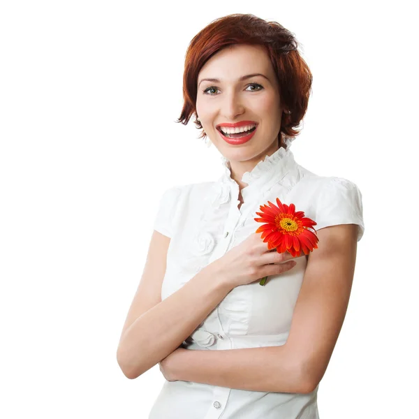 Piękna kobieta z gerbera kwiat w jej ręce przed b biały — Zdjęcie stockowe