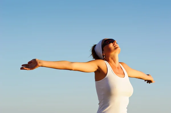 stock image Girl with arms raised towards the sky
