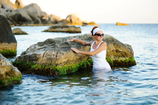Beautiful woman splashing in the sea — Stock Photo, Image