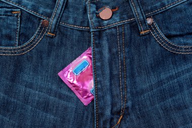 Condom in jeans zipper clipart