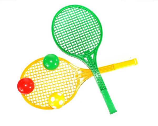 Multi-colored balls on rackets — Stock Photo, Image