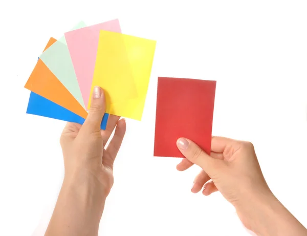 Multi-gekleurde kaarten in handen — Stockfoto