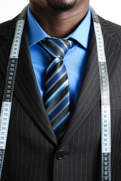 Homem de negócios com fita métrica — Fotografia de Stock