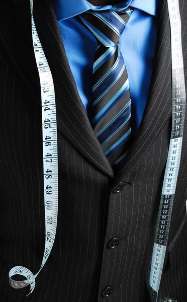 Business man with tape measure — Stock Photo, Image