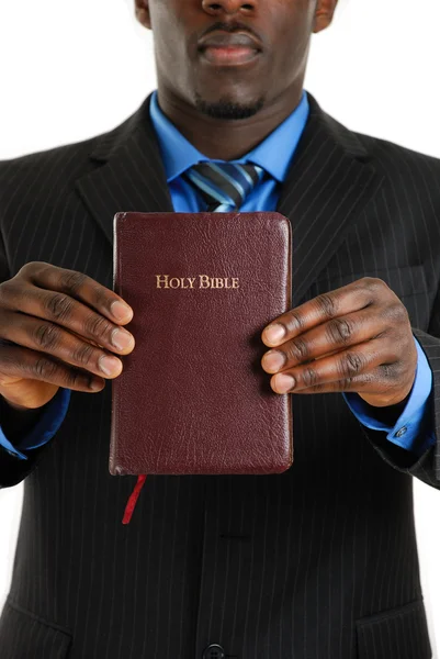 Business man holding a bible — Stock Photo, Image