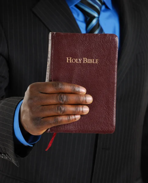 Business man holding a bible — Stock Photo, Image