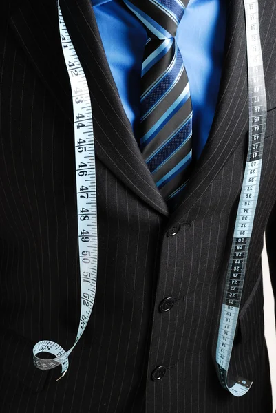 Homme d'affaires avec ruban à mesurer — Photo