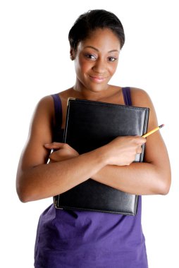 Young female student holding pencil and book clipart