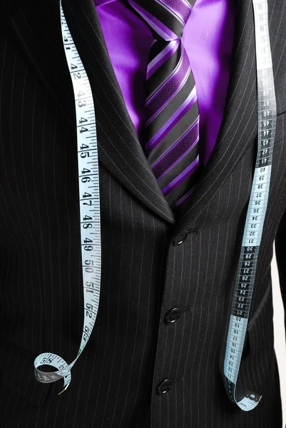 Business man with tape measure — Stock Photo, Image