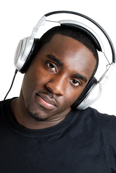 Young man listenning to music on headphones — Stock Photo, Image