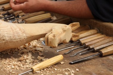 Wood carving sculpture of a wooden horse clipart