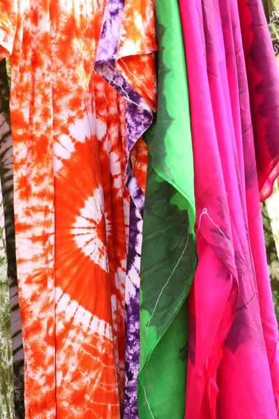 stock image African dresses colored on a market for the sale