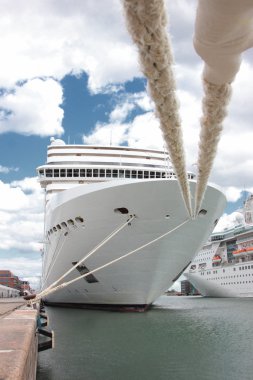 Front of a cruise ship docked at a port in Norway clipart