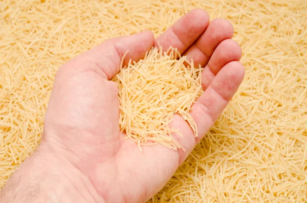 Vermicelli in hand — Stock Photo, Image
