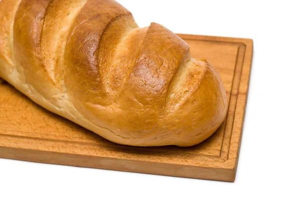 Pão na tábua de pão — Fotografia de Stock